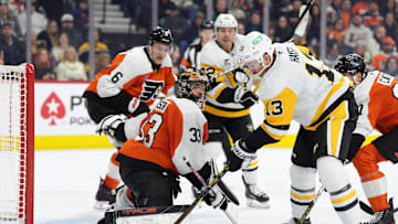 Feb 8, 2025; Philadelphia, Pennsylvania, USA; Philadelphia Flyers goalie Samuel Ersson (33) makes a save against Pittsburgh Penguins right wing Kevin Hayes (13) in the third period at Wells Fargo Center. Mandatory Credit: Kyle Ross-Imagn Images