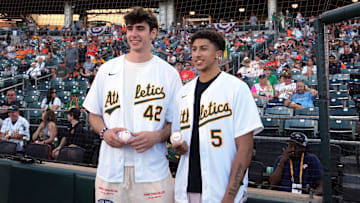 Jul 5, 2025; West Sacramento, California, USA; Sacramento Kings draft picks Maxime Raynaud (left) and Nique Clifford (right) pose for a photo before the game between the Athletics and the San Francisco Giants at Sutter Health Park. Mandatory Credit: Darren Yamashita-Imagn Images