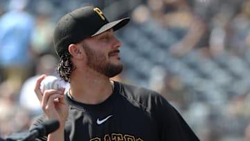Sep 21, 2025; Pittsburgh, Pennsylvania, USA;  Pittsburgh Pirates pitcher Paul Skenes (30) tosses a ball to fans before the game against the Athletics at PNC Park. Mandatory Credit: Charles LeClaire-Imagn Images