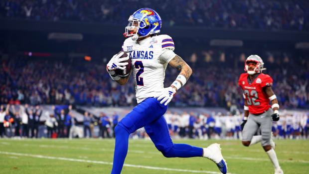 Dec 26, 2023; Phoenix, AZ, USA; Kansas Jayhawks wide receiver Lawrence Arnold (2) runs for a touchdown during the second half