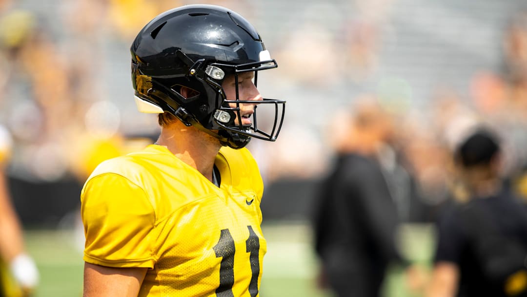 Aug 9, 2025; Iowa quarterback Mark Gronowski (11) runs a drill during the Hawkeyes Kids Day NCAA football open practice at Kinnick Stadium in Iowa City, Iowa. Mandatory Credit: Joseph Cress for the Des Moines Register