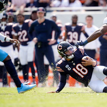 Caleb Williams slides after a scramble on a day against Tennessee when he had difficulties hooking up with his receivers.