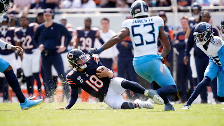 Caleb Williams slides after a scramble on a day against Tennessee when he had difficulties hooking up with his receivers.