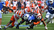 Sep 6, 2025; Durham, North Carolina, USA;  Duke Blue Devils cornerback Kimari Robinson (5) is tackled by Illinois Fighting Illini linebacker Jojo Hayden (30), linebacker Kenenna Odeluga (39), linebacker Ismael Kante (26) and defensive lineman Gentle Hunt (92) during the fourth quarter at Wallace Wade Stadium. Mandatory Credit: Zachary Taft-Imagn Images