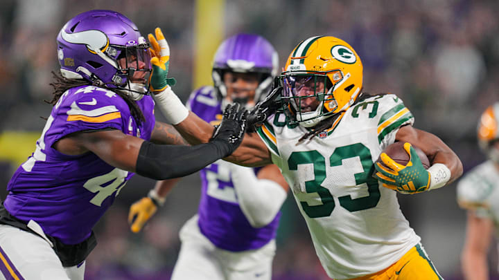 Dec 31, 2023; Minneapolis, Minnesota, USA; Green Bay Packers running back Aaron Jones (33) runs with