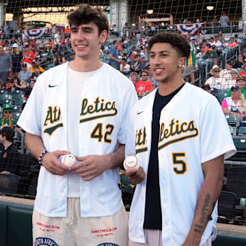 Jul 5, 2025; West Sacramento, California, USA; Sacramento Kings draft picks Maxime Raynaud (left) and Nique Clifford (right) pose for a photo before the game between the Athletics and the San Francisco Giants at Sutter Health Park. Mandatory Credit: Darren Yamashita-Imagn Images