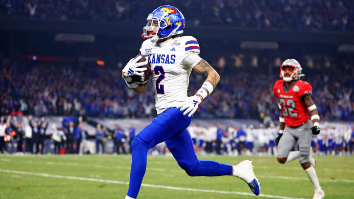 Dec 26, 2023; Phoenix, AZ, USA; Kansas Jayhawks wide receiver Lawrence Arnold (2) runs for a touchdown.