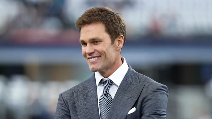 Fox Sports color analyst Tom Brady stands on the field before a game. Fox Sports color analyst Tom Brady stands on the field before a game.