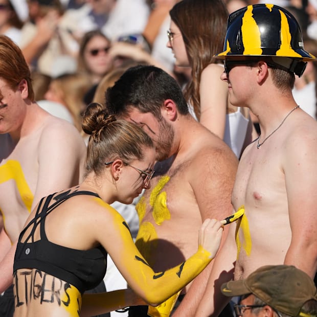 Missouri Tigers fans apply body paint against the Buffalo Bulls prior to a game Faurot Field at Memorial Stadium.