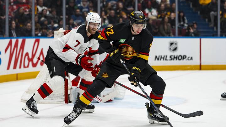 Jan 23, 2026; Vancouver, British Columbia, CAN; New Jersey Devils defesneman Dougie Hamilton (7) defends against Vancouver Canucks forward Filip Chytil (72) in the second period at Rogers Arena. Mandatory Credit: Bob Frid-Imagn Images