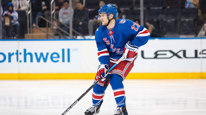 Apr 5, 2026; New York, New York, USA; New York Rangers defenseman Adam Fox (23) skates against the Washington Capitals during the second period at Madison Square Garden.