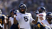 Nov 1, 2025; Berkeley, California, USA; Virginia Cavaliers linebacker Kam Robinson (5) reacts after sacking California Golden Bears quarterback Jaron-Keawe Sagapolutele (not pictured) during the second quarter at California Memorial Stadium. Mandatory Credit: D. Ross Cameron-Imagn Images