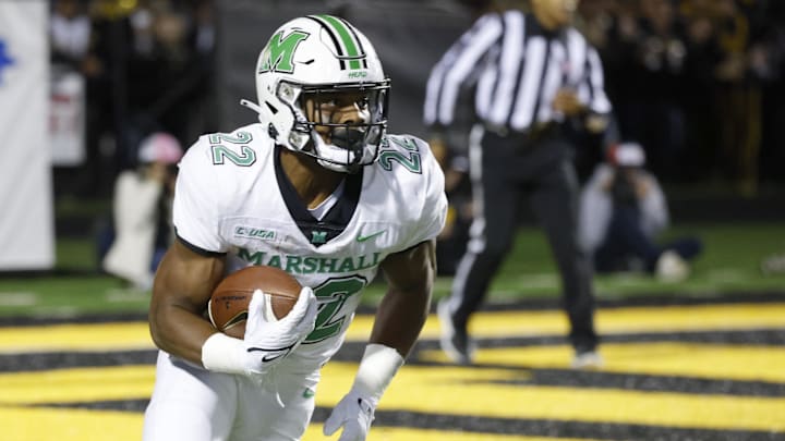 Sep 23, 2021; Boone, North Carolina, USA;  Marshall Thundering Herd running back Rasheen Ali (22) runs back a kickoff for a touchdown during the second quarter against the Appalachian State Mountaineers at Kidd Brewer Stadium. Mandatory Credit: Reinhold Matay-Imagn Images