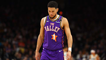 Dec 19, 2024; Phoenix, Arizona, USA; Phoenix Suns guard Devin Booker (1) against the Indiana Pacers at Footprint Center. Mandatory Credit: Mark J. Rebilas-Imagn Images