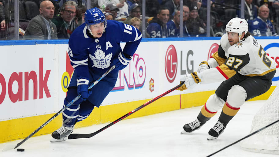 Toronto Maple Leafs right wing Mitchell Marner skates past Vegas Golden Knights defenseman Shea Theodore | Nick Turchiaro-Imagn Images
