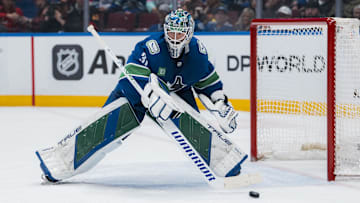 Mar 15, 2025; Vancouver, British Columbia, CAN; Vancouver Canucks goalie Arturs Silovs (31) handles the puck against the Chicago Blackhawks in the second period at Rogers Arena. Mandatory Credit: Bob Frid-Imagn Images