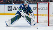 Mar 15, 2025; Vancouver, British Columbia, CAN; Vancouver Canucks goalie Arturs Silovs (31) handles the puck against the Chicago Blackhawks in the second period at Rogers Arena. Mandatory Credit: Bob Frid-Imagn Images