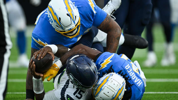 Thomas Harper makes a sack for the Los Angeles Chargers in a game against the Seattle Seahawks.