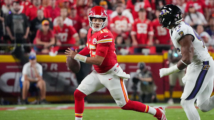 Sep 5, 2024; Kansas City, Missouri, USA; Kansas City Chiefs quarterback Patrick Mahomes (15) runs the ball against the Baltimore Ravens during the game at GEHA Field at Arrowhead Stadium. Mandatory Credit: Denny Medley-Imagn Images