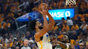 Golden State Warriors forward Trayce Jackson-Davis (32) shoots over Minnesota Timberwolves guard Anthony Edwards (5) in the first quarter during game three of the second round for the 2025 NBA Playoffs at Chase Center.