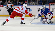 Oct 14, 2024; New York, New York, USA;  New York Rangers goaltender Igor Shesterkin (31) makes a glove save on Detroit Red Wings left wing J.T. Compher (37) during the second period at Madison Square Garden. Mandatory Credit: Dennis Schneidler-Imagn Images