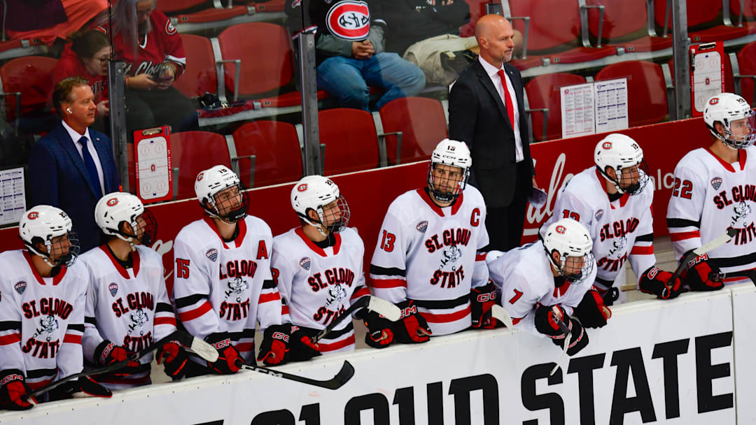 St. Cloud State hockey coach Brett Larson stands behind the Husky bench during the opening game of the season against St. Thomas on Oct. 4, 2025 at the Herb Brooks National Hockey Center. SCSU lost 4-3.