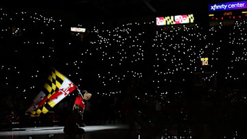 Nov 15, 2024; College Park, Maryland, USA; The Maryland Terrapins mascot waives a Maryland flag before a game against the Marquette Golden Eagles at Xfinity Center. Mandatory Credit: Daniel Kucin Jr.-Imagn Images


