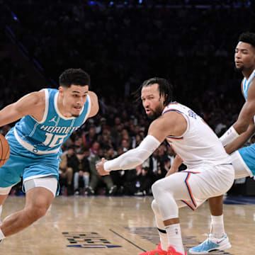 Dec 5, 2024; New York, New York, USA; Charlotte Hornets guard Josh Green (10) drives to the basket while being defended by New York Knicks guard Jalen Brunson (11) during the first half at Madison Square Garden. Mandatory Credit: John Jones-Imagn Images