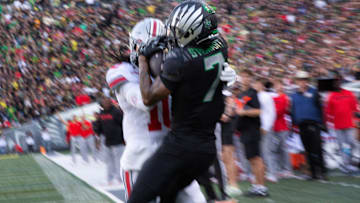 Oregon’s Evan Stewart pulls down a touchdown pass against Ohio State’s Denzel Burke during the first quarter at Autzen Stadium Saturday, Oct. 12, 2024.
