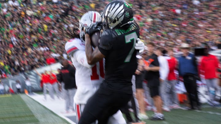 Oregon’s Evan Stewart pulls down a touchdown pass against Ohio State’s Denzel Burke during the first quarter at Autzen Stadium Saturday, Oct. 12, 2024.