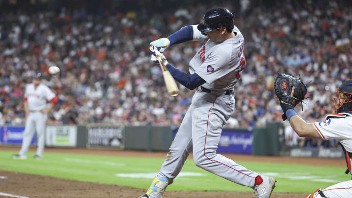 Aug 20, 2024; Houston, Texas, USA; Boston Red Sox first baseman Triston Casas (36) hits an RBI single during the fourth inning against the Houston Astros at Minute Maid Park. Mandatory Credit: Troy Taormina-USA TODAY Sports