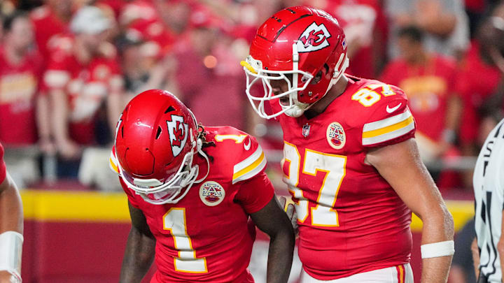 Sep 5, 2024; Kansas City, Missouri, USA; Kansas City Chiefs tight end Travis Kelce (87) celebrates with wide receiver Xavier Worthy (1) after a touchdown against the Baltimore Ravens during the second half at GEHA Field at Arrowhead Stadium. Mandatory Credit: Denny Medley-Imagn Images