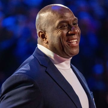 February 20, 2022; Cleveland, Ohio, USA; NBA great Magic Johnson is honored for being selected to the NBA 75th Anniversary Team during halftime in the 2022 NBA All-Star Game at Rocket Mortgage FieldHouse. Mandatory Credit: Kyle Terada-USA TODAY Sports