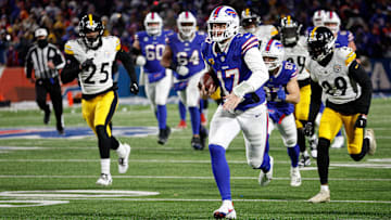 Buffalo Bills quarterback Josh Allen (17) runs 52 yards for a touchdown in a 31-17 playoff win over the Steelers.