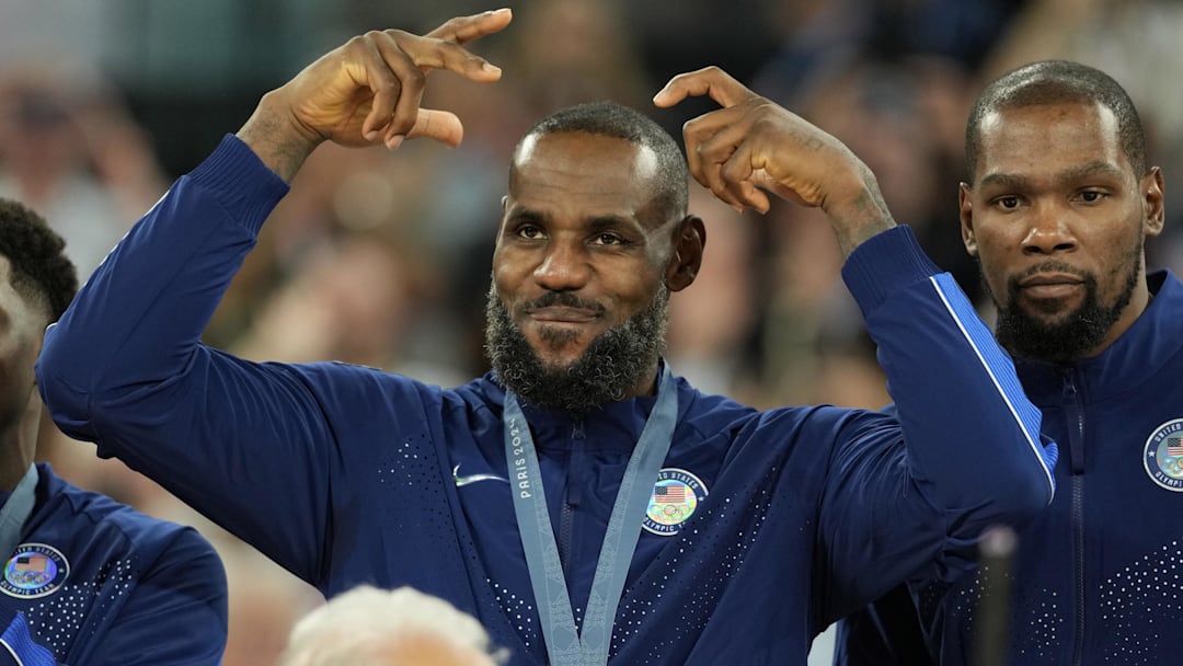 Aug 10, 2024; Paris, France; United States guard LeBron James (6) celebrates with the gold medal after the game against France in the men's basketball gold medal game during the Paris 2024 Olympic Summer Games at Accor Arena. Mandatory Credit: Kyle Terada-Imagn Images