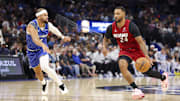 Dec 5, 2025; Orlando, Florida, USA; Miami Heat guard Norman Powell (24) drives to the basket past Orlando Magic guard Jalen Suggs (4) in the second quarter at Kia Center. Mandatory Credit: Nathan Ray Seebeck-Imagn Images
