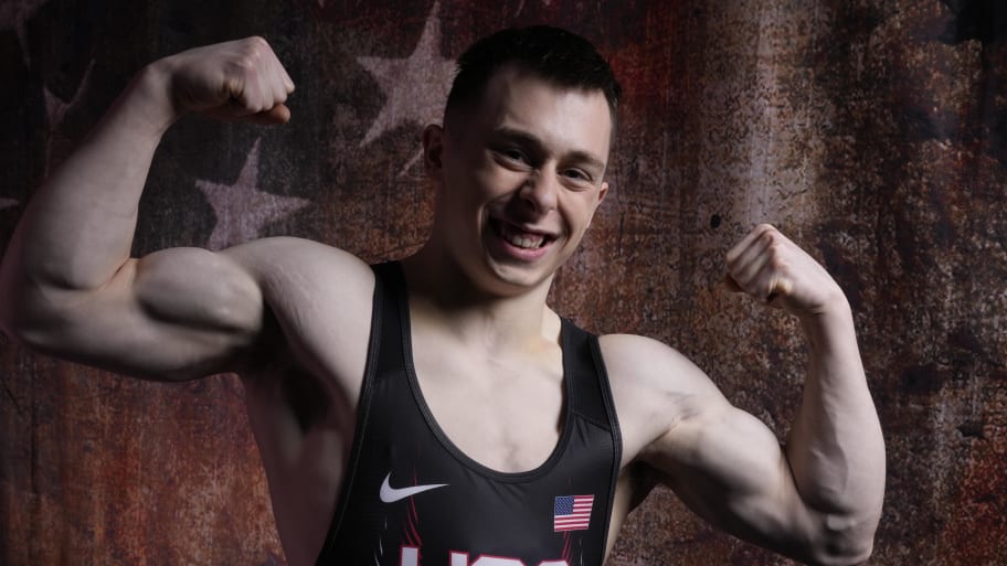 Hampton Morris flexes his biceps at Team USA media shoot for 2024 Olympics