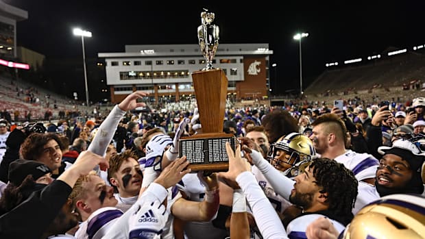 The Huskies celebrate a 2022 Apple Cup victory in Pullman. 