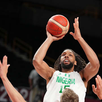 Jul 28, 2021; Saitama, Japan; Nigeria player Jahlil Okafor (15) shoots over Germany player Moritz Wagner (13) during the Tokyo 2020 Olympic Summer Games at Saitama Super Arena. Mandatory Credit: Kyle Terada-Imagn Images