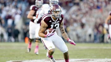 Oct 19, 2013; College Station, TX, USA; Texas A&M Aggies wide receiver Mike Evans (13) looks to run after making a catch against the Auburn Tigers during the second half at Kyle Field. Tigers won 45-41. Mandatory Credit: Soobum Im-Imagn Images