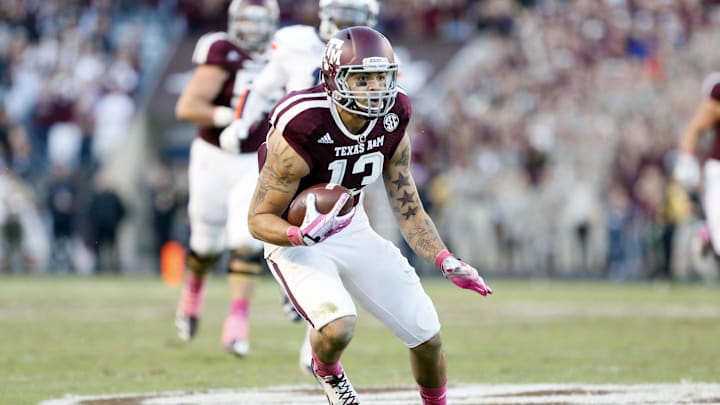 Oct 19, 2013; College Station, TX, USA; Texas A&M Aggies wide receiver Mike Evans (13) looks to run after making a catch against the Auburn Tigers during the second half at Kyle Field. Tigers won 45-41. Mandatory Credit: Soobum Im-Imagn Images