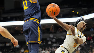 Dec 3, 2024; Columbia, Missouri, USA; Missouri Tigers guard Anthony Robinson II (0) is fouled by California Golden Bears center Mady Sissoko (12) while shooting during the first half at Mizzou Arena. Mandatory Credit: Denny Medley-Imagn Images