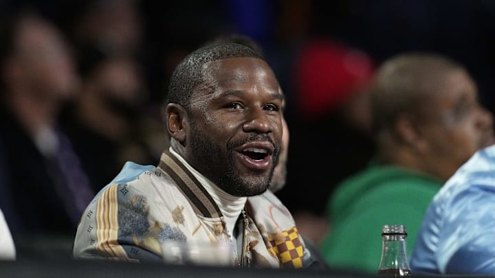 Floyd Mayweather looks on at an NBA game