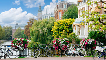 A sunny canal view in Amsterdam, Netherlands.