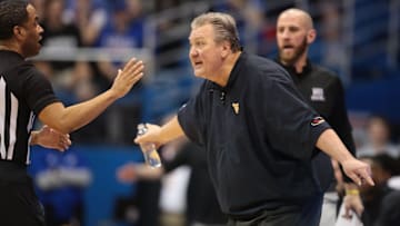 West Virginia coach Bob Huggins argues with a referee during the second half of Saturday's game against Kansas inside Allen Fieldhouse.