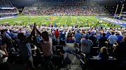 Kansas Jayhawks fans yell out after a play during the second half of the game against West Virginia Mountaineers at David Booth Kansas Memorial Stadium on Sept. 20, 2025.