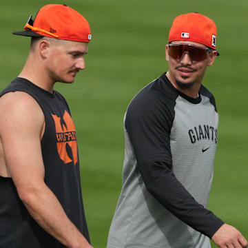 Feb 13, 2025; Scottsdale, AZ, USA; San Francisco Giants third base Matt Chapman (26) and shortstop Willy Adames (2) talk during spring training camp.