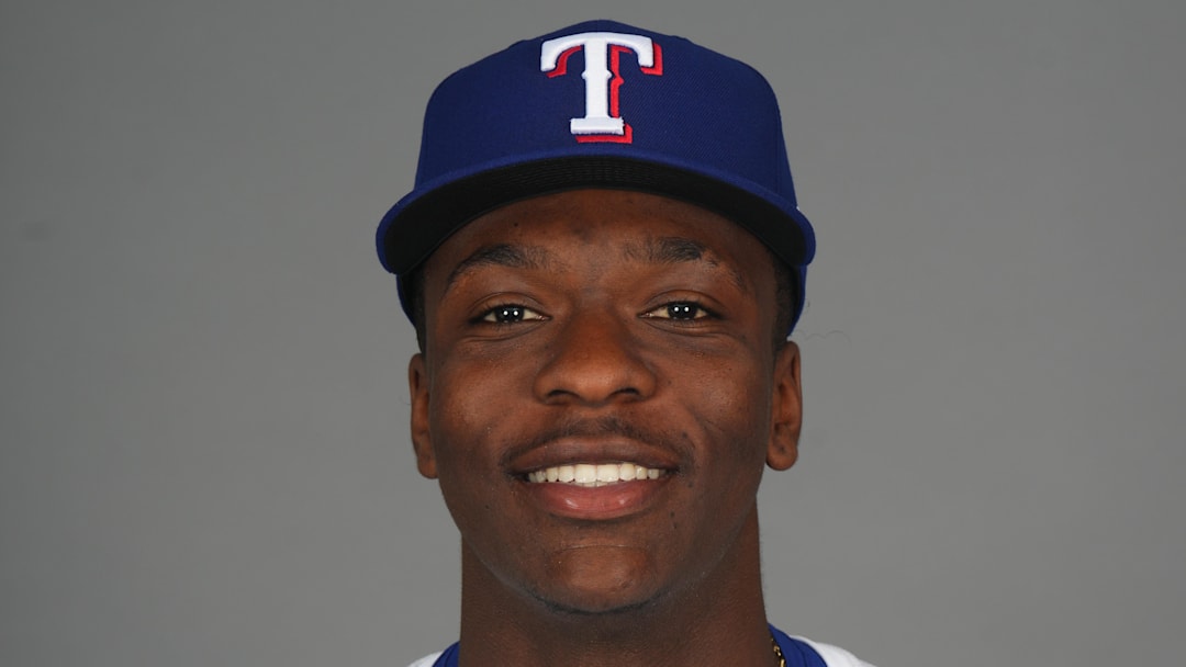 Feb 19, 2025; Surprise, AZ, USA; Texas Rangers player Sebastian Walcott poses for a photo during Media Day at Surprise Stadium. 