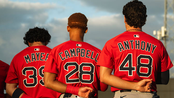 Boston's top-three prospects in Marcelo Mayer, Kristian Campbell and Roman Anthony stand for the national anthem ahead of a Spring Training breakout game on March 13, 2025.