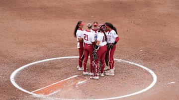 Oklahoma players gather on the field during a Women's College World Series softball game between the Oklahoma Sooners (OU) and the Tennessee Volunteers at Devon Park in Oklahoma City, Thursday, May 29, 2025.